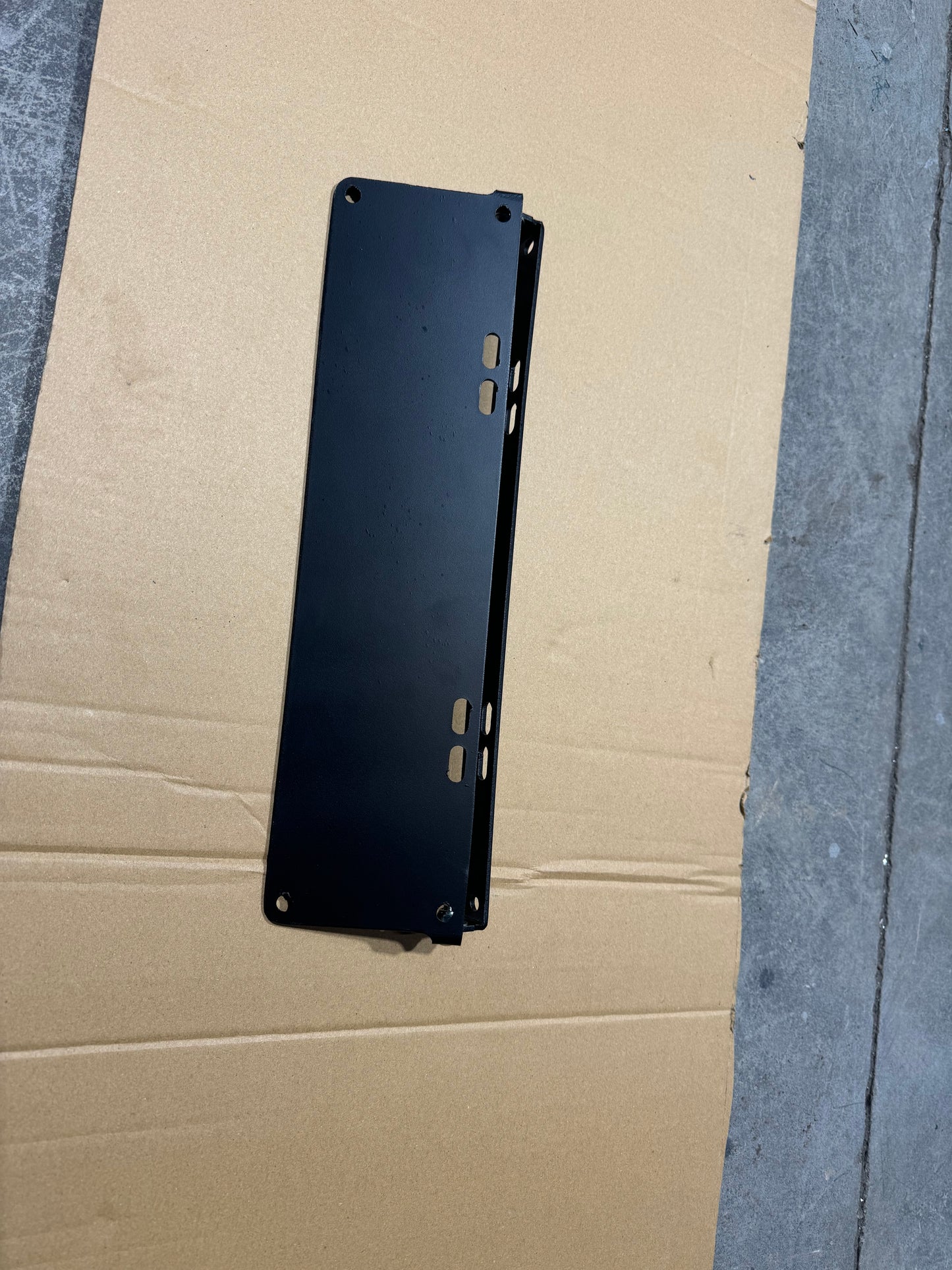 Flip up number plate bracket